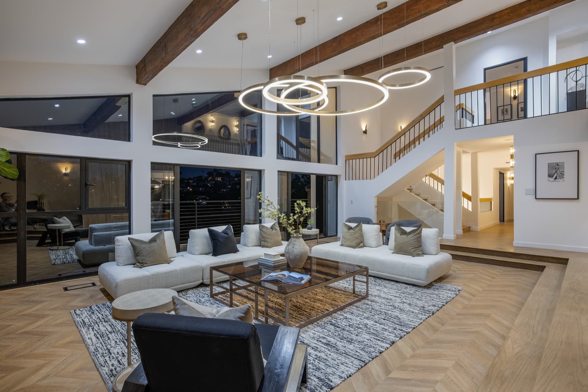 Claremont Residence — double-height great room behind a full window wall
