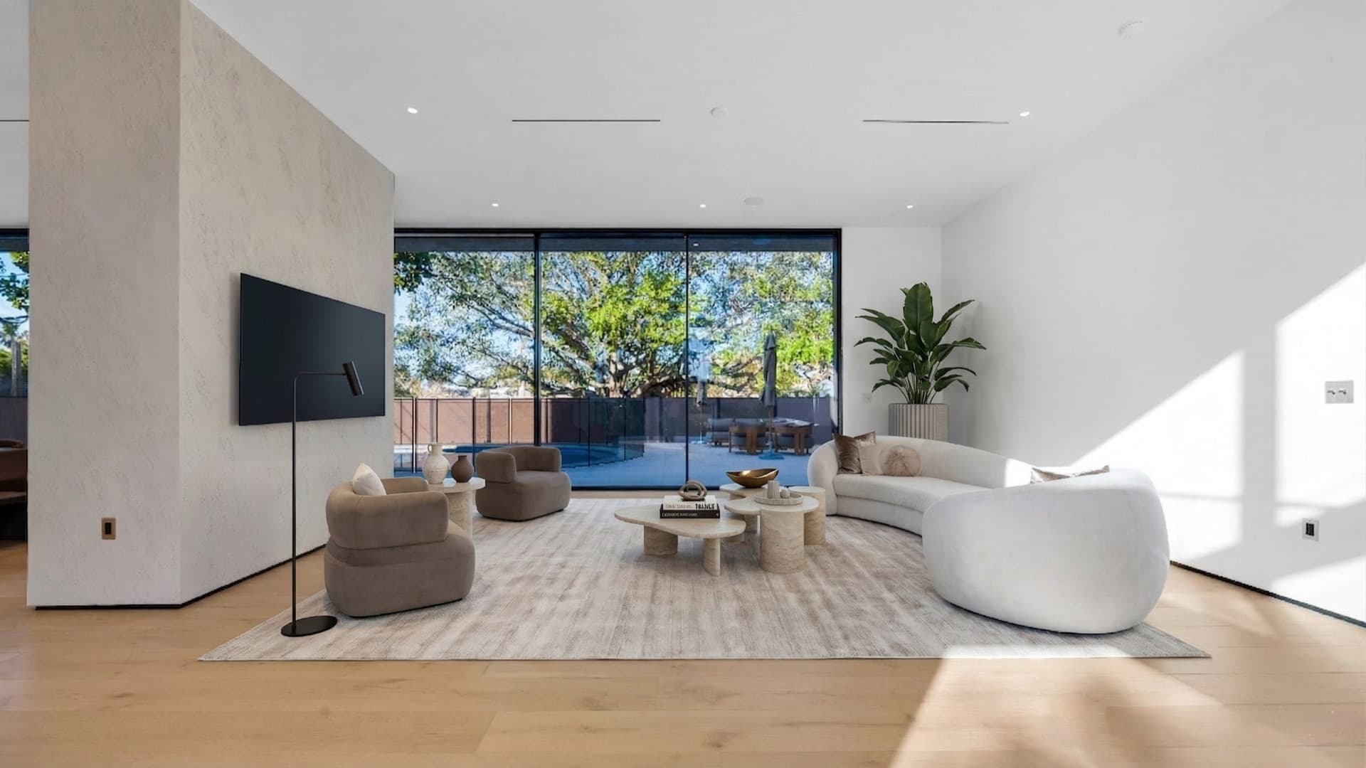 North Miami Beach Residence — wall-wide slider open to the covered terrace
